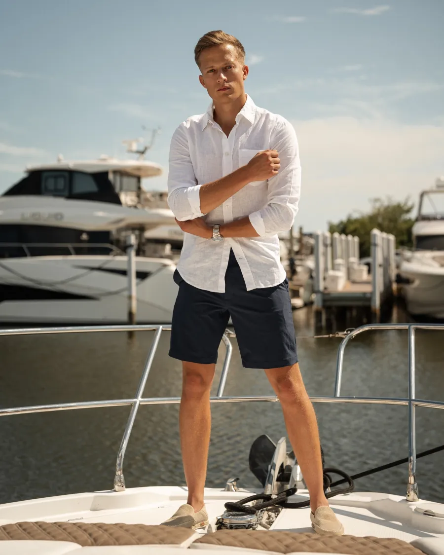 Torin Christianson on a boat at a marina